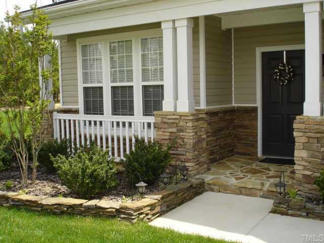 5412 Glass Ridge Road Raleigh, NC 27616 - Photo 2 of 12 a view of house with backyard space and garden