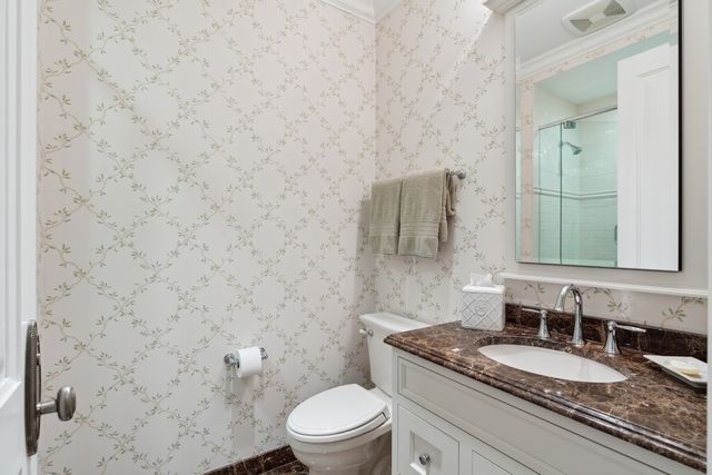 a open dining room with stainless steel appliances kitchen island granite countertop a table chairs and a refrigerator