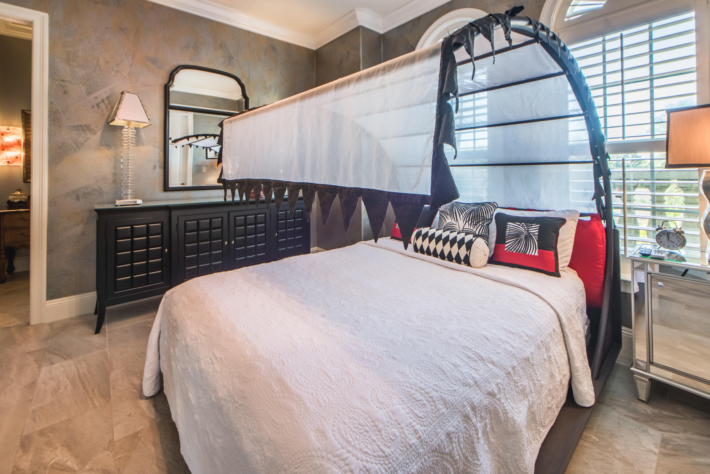 59 St Tropez Court Miramar Beach, FL 32550 - Photo 26 of 37 a bedroom with a bed and a large mirror