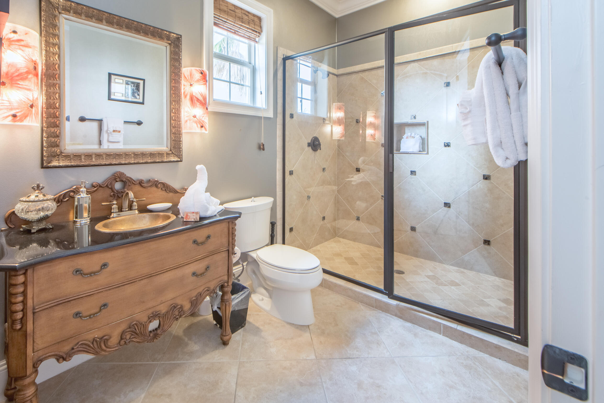 59 St Tropez Court Miramar Beach, FL 32550 - Photo 28 of 37 a bathroom with a granite countertop sink toilet a mirror and shower