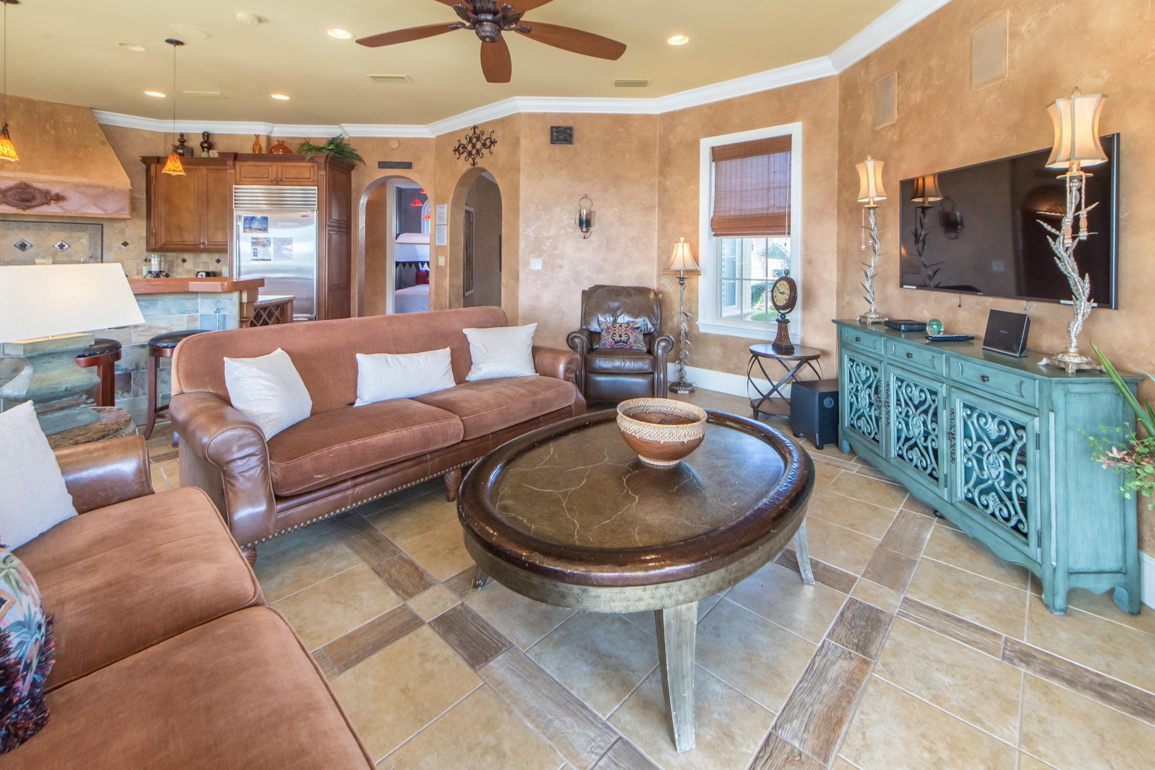 59 St Tropez Court Miramar Beach, FL 32550 - Photo 8 of 37 a living room with furniture a flat screen tv and a chandelier
