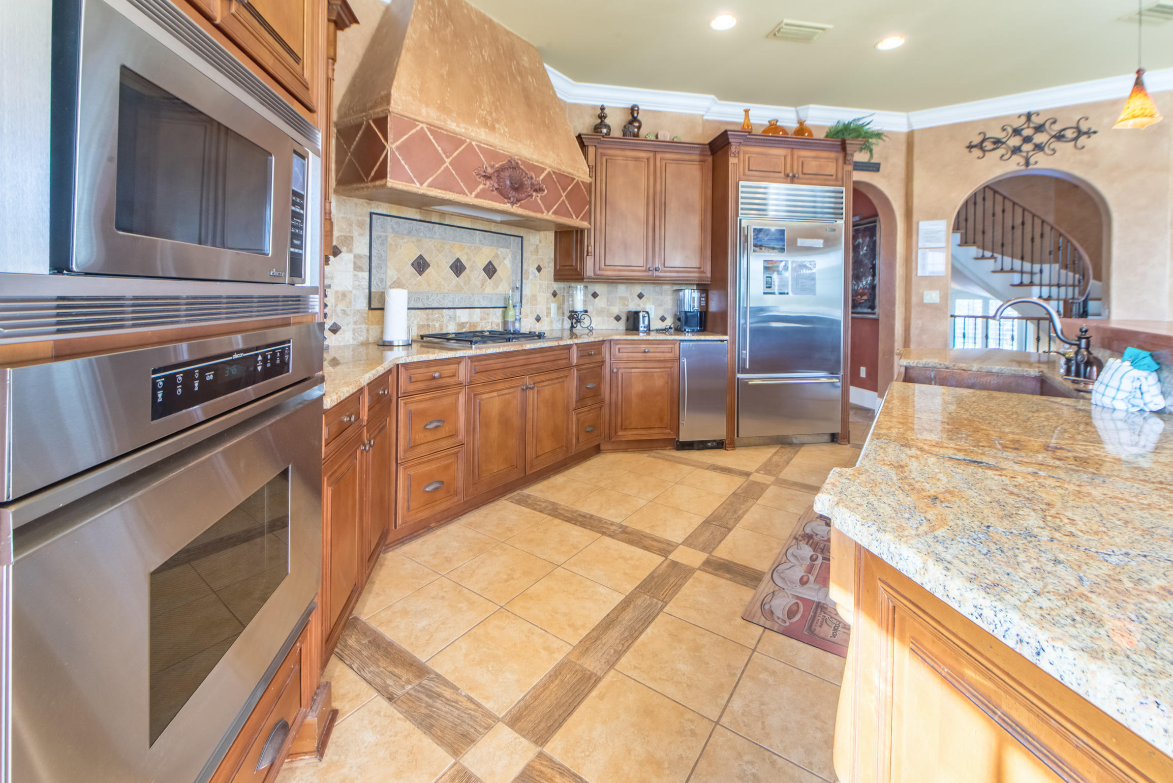 59 St Tropez Court Miramar Beach, FL 32550 - Photo 10 of 37 a kitchen with stainless steel appliances granite countertop a sink and cabinets