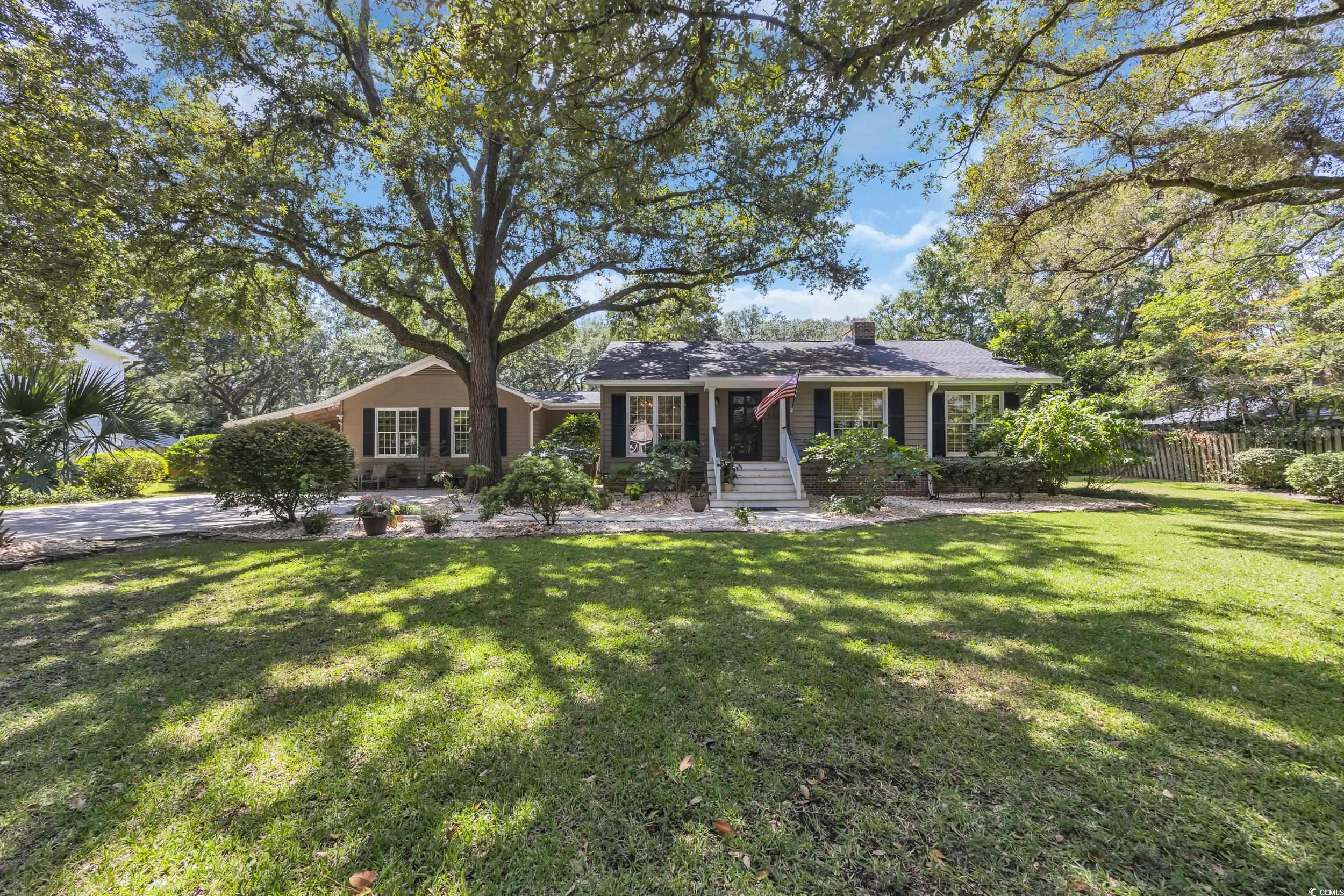 Ranch-style house featuring a chimney