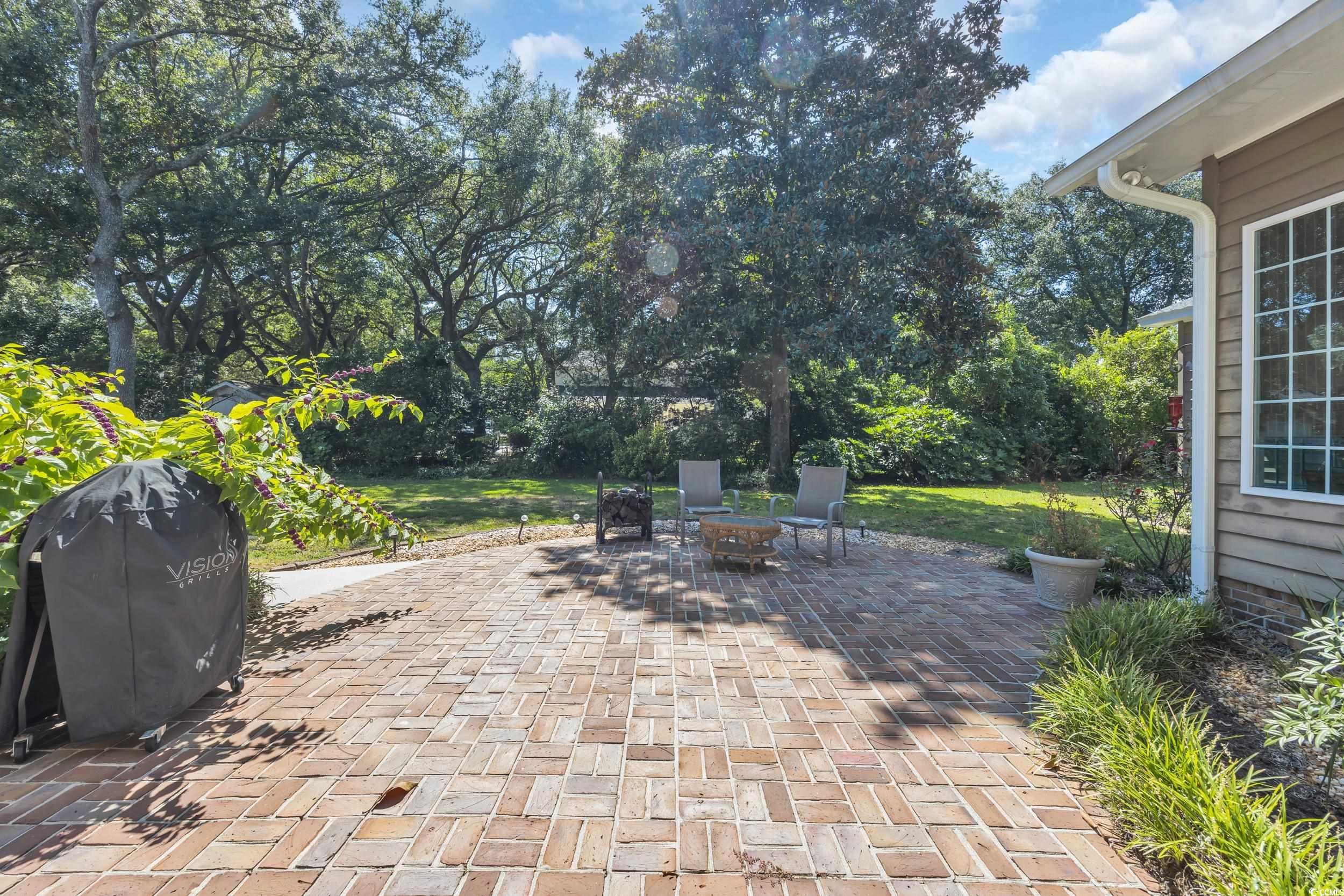 855 Riven Oak Drive Murrells Inlet, SC 29576 - Photo 32 of 37 View of patio featuring a grill and a fire pit