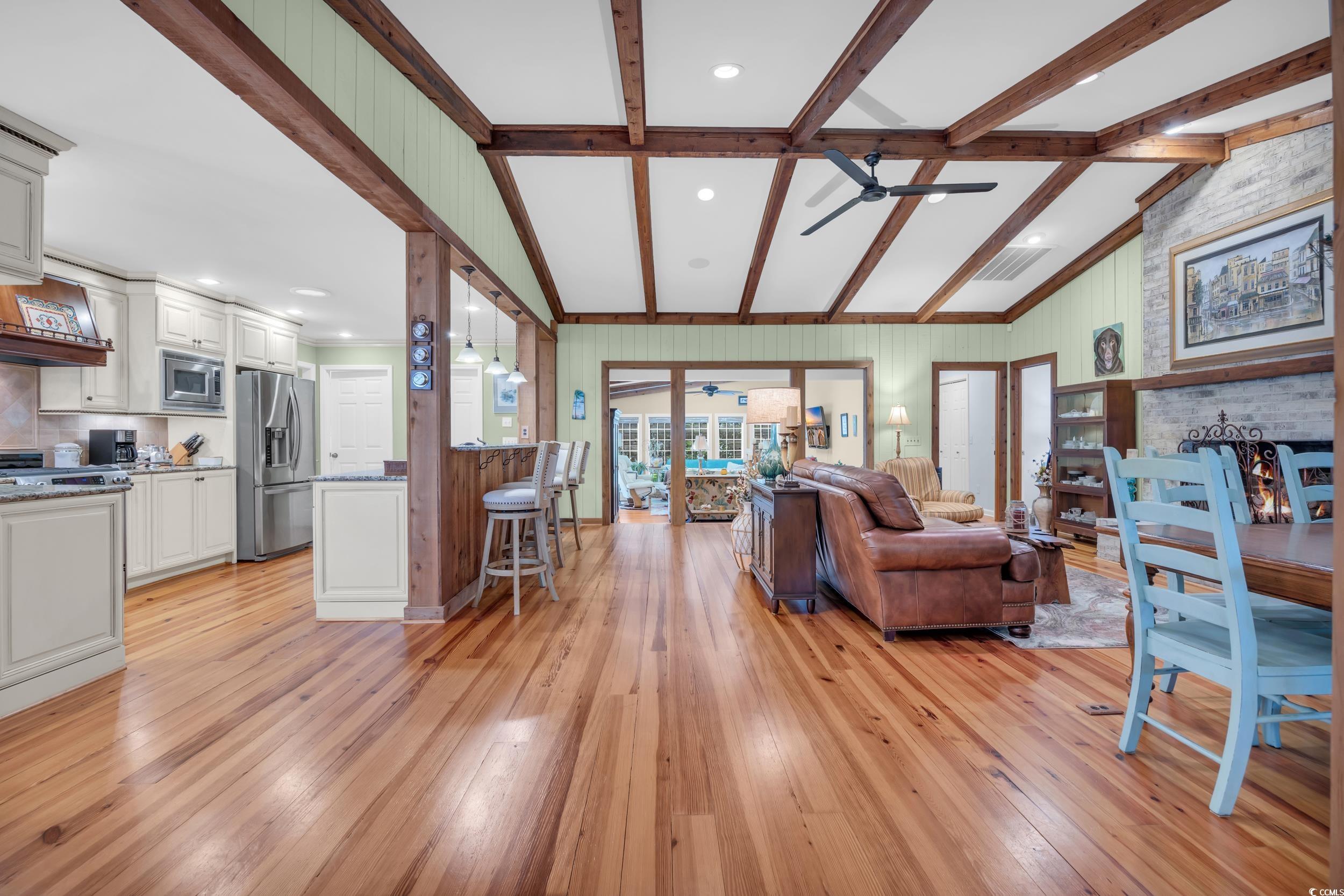 855 Riven Oak Drive Murrells Inlet, SC 29576 - Photo 4 of 37 Living room featuring light wood-style flooring, a large fireplace, recessed lighting, and a ceiling fan