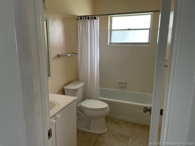 2929 Southeast Ocean Boulevard, Unit 10810 Stuart, FL 34996 - Photo 12 of 24 a bathroom with a granite countertop toilet a sink and shower