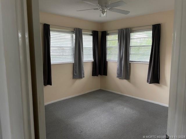 2929 Southeast Ocean Boulevard, Unit 10810 Stuart, FL 34996 - Photo 13 of 24 an empty room with windows and closet