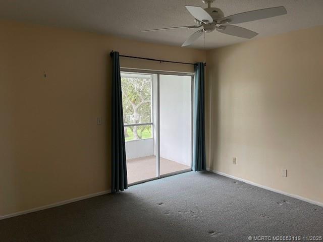2929 Southeast Ocean Boulevard, Unit 10810 Stuart, FL 34996 - Photo 18 of 24 an empty room with windows and fan