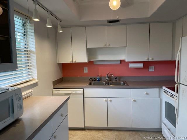 2929 Southeast Ocean Boulevard, Unit 10810 Stuart, FL 34996 - Photo 10 of 24 a kitchen with granite countertop cabinets and appliances