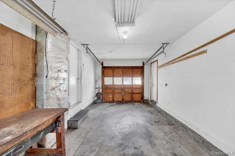 a view of a room with window and furniture