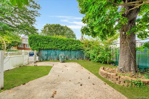 a view of a backyard with a small cabin