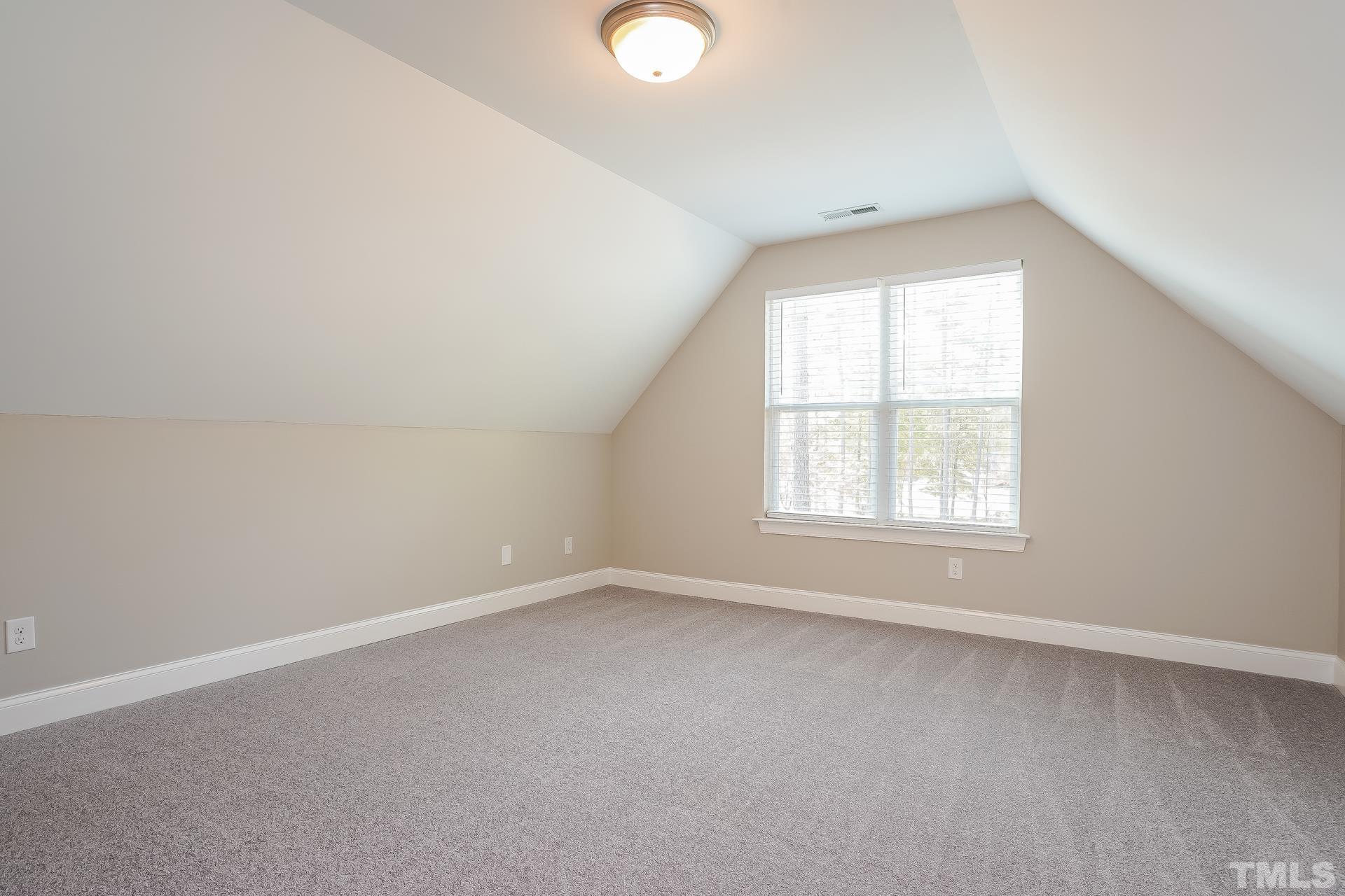 49 Burrage Drive Angier, NC 27501 - Photo 11 of 17 an empty room with a window