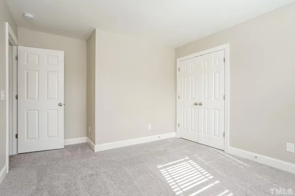 a view of wooden floor and windows in a room