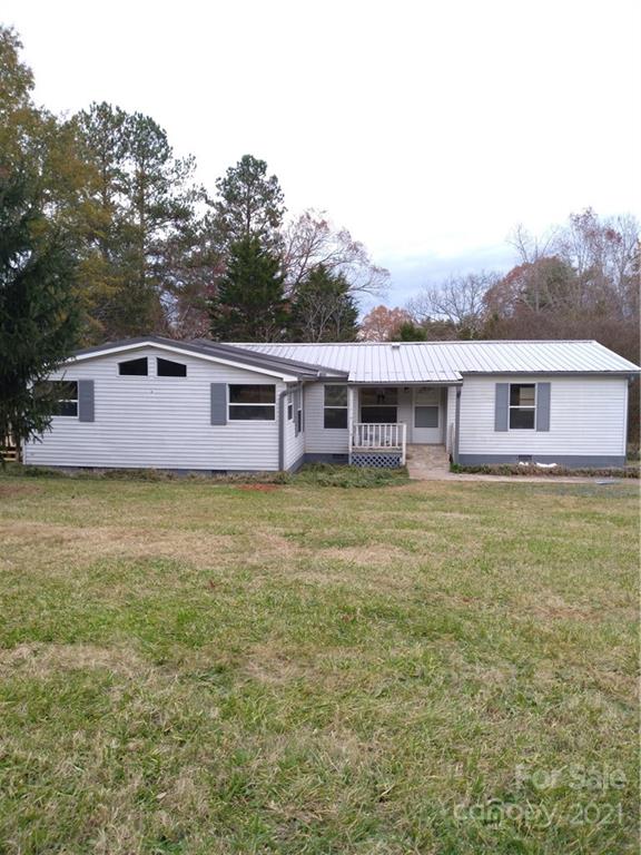 245 Roy Goins Road Rutherfordton, NC 28139 - Photo 1 of 23 a view of a house with a garden and deck