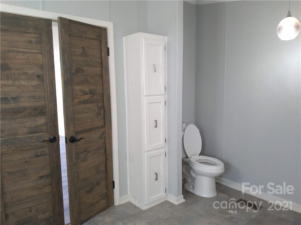 245 Roy Goins Road Rutherfordton, NC 28139 - Photo 14 of 23 a bathroom with a toilet and a shower