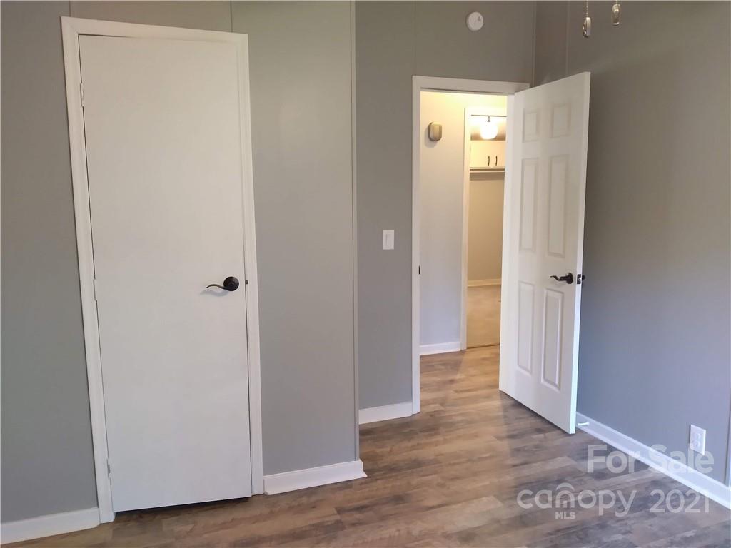 245 Roy Goins Road Rutherfordton, NC 28139 - Photo 16 of 23 a view of a hallway with wooden floor