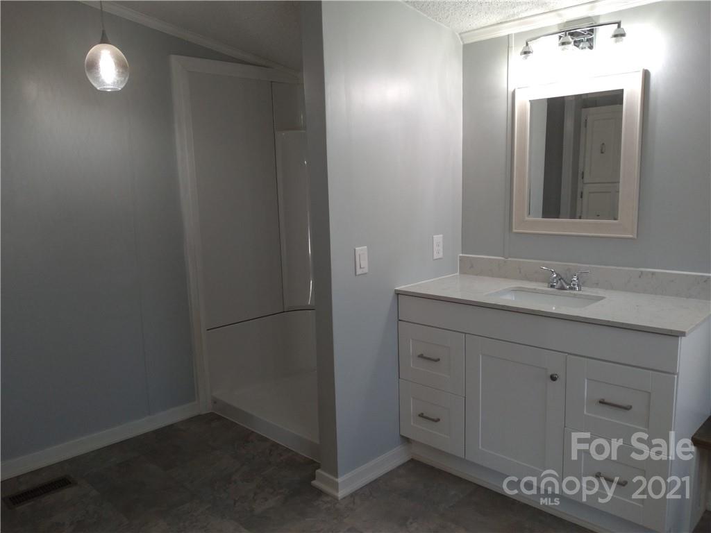 245 Roy Goins Road Rutherfordton, NC 28139 - Photo 17 of 23 a bathroom with a sink and a mirror