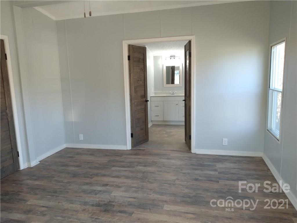 245 Roy Goins Road Rutherfordton, NC 28139 - Photo 18 of 23 wooden floor in an empty room