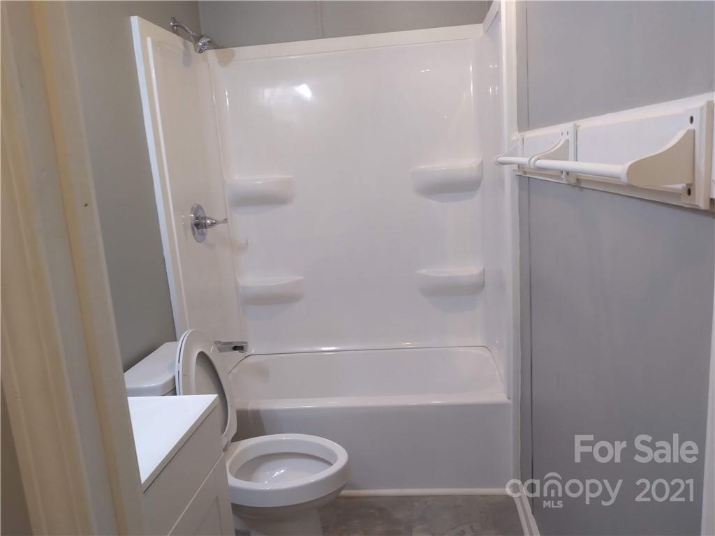 245 Roy Goins Road Rutherfordton, NC 28139 - Photo 21 of 23 a bathroom with a toilet and a shower