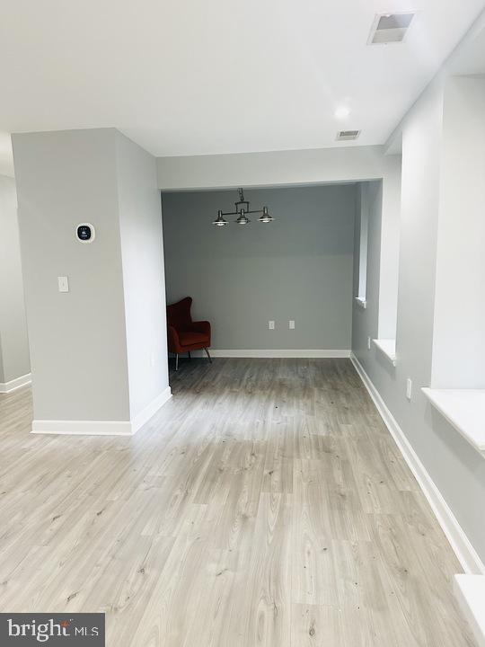 1308 Clifton Street Northwest, Unit 105 Washington, DC 20009 - Photo 11 of 21 a view of empty room with wooden floor
