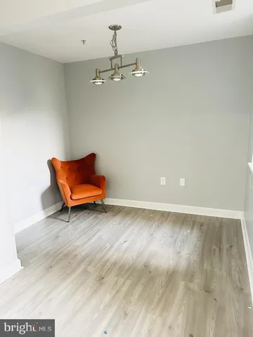 a room with a wooden floor and couch