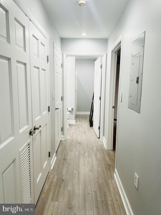 1308 Clifton Street Northwest, Unit 105 Washington, DC 20009 - Photo 16 of 21 a view of a hallway with wooden floor and staircase