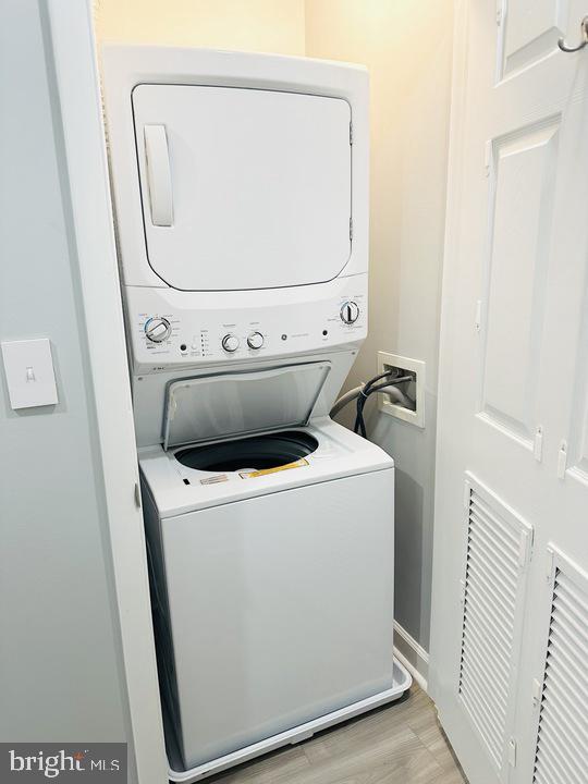1308 Clifton Street Northwest, Unit 105 Washington, DC 20009 - Photo 17 of 21 a utility room with dryer and washer