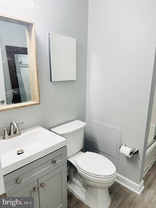 1308 Clifton Street Northwest, Unit 105 Washington, DC 20009 - Photo 19 of 21 a white toilet sitting next to a bathroom sink