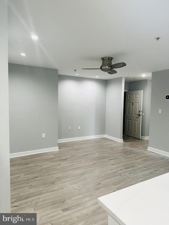 1308 Clifton Street Northwest, Unit 105 Washington, DC 20009 - Photo 8 of 21 a view of empty room with wooden floor