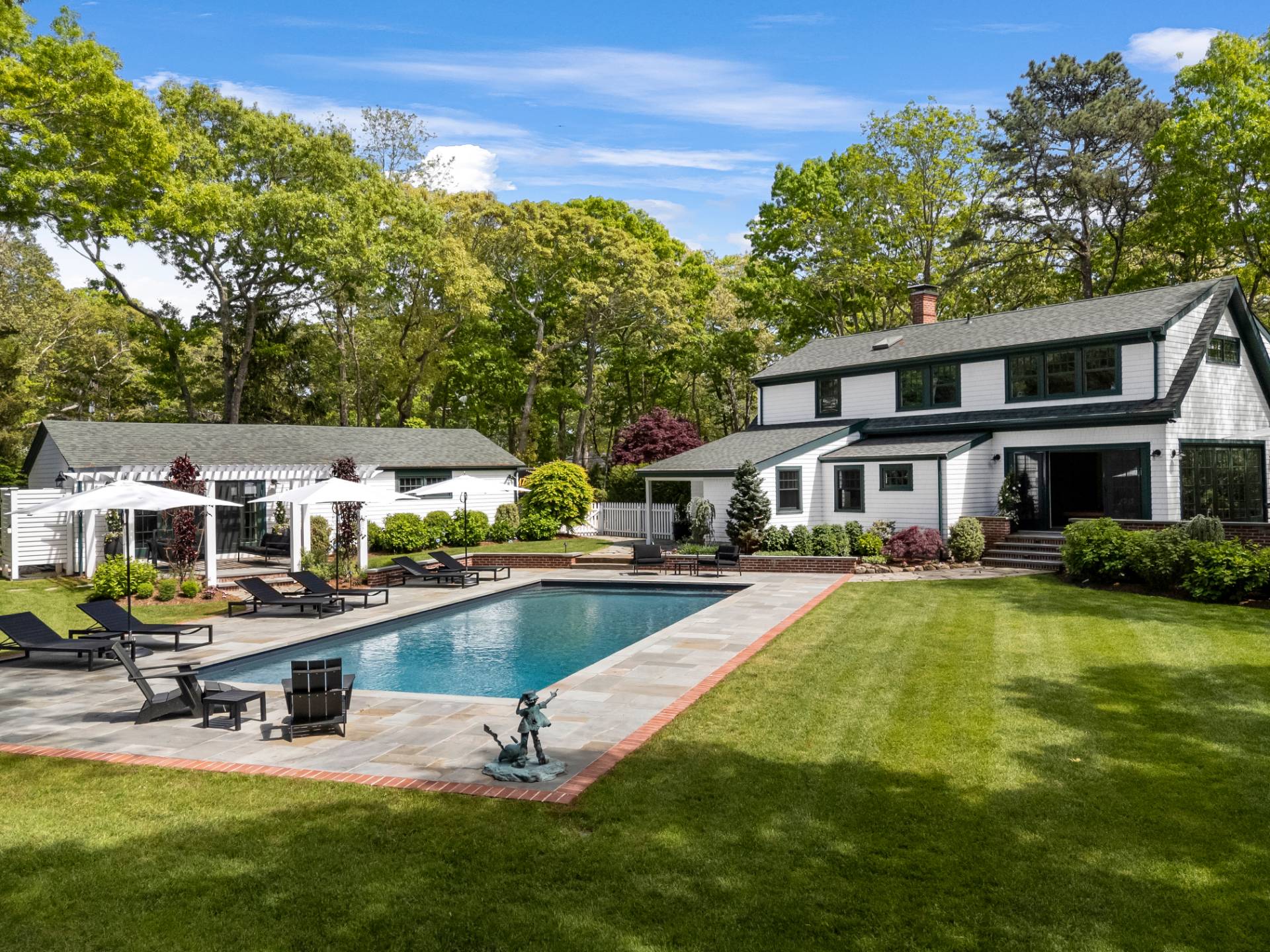 91 East Tiana Road Hampton Bays, NY 11946 - Photo 38 of 46 a view of a house with swimming pool and sitting area