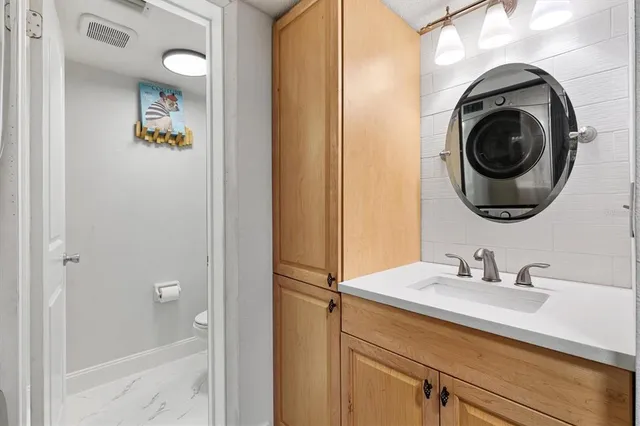 a close view of utility room with washer and dryer