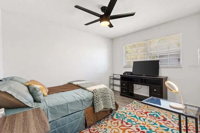 a bedroom with furniture and a window