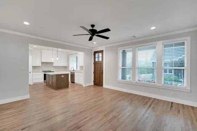 a view of kitchen with granite countertop window and a sink