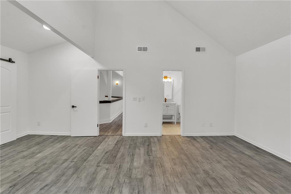 5483 Wylstream Way Norcross, GA 30093 - Photo 25 of 56 wooden floor in an empty room