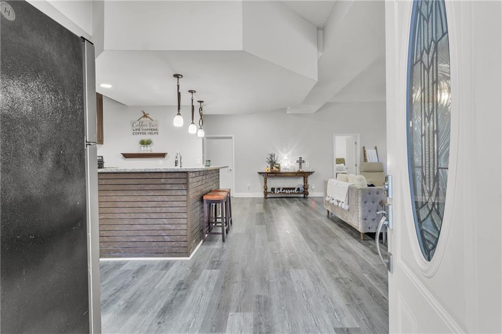 5483 Wylstream Way Norcross, GA 30093 - Photo 32 of 56 a kitchen with cabinets and wooden floor