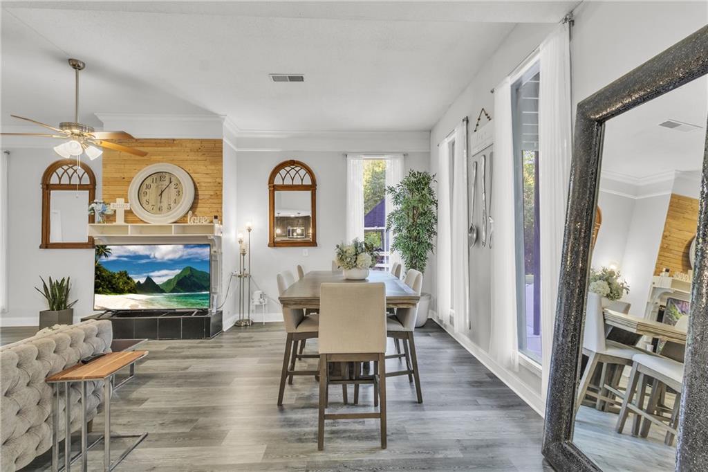 5483 Wylstream Way Norcross, GA 30093 - Photo 33 of 56 a view of a dining room with furniture window and wooden floor