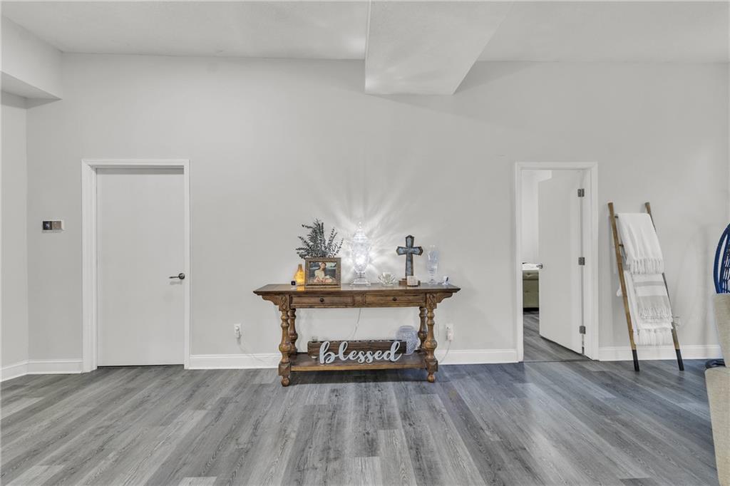 5483 Wylstream Way Norcross, GA 30093 - Photo 36 of 56 a view of a hallway with wooden floor and staircase