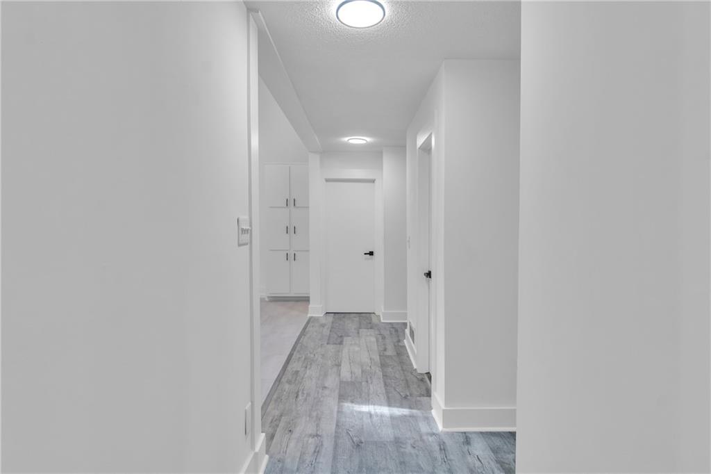 5483 Wylstream Way Norcross, GA 30093 - Photo 4 of 56 a view of hallway with wooden floor