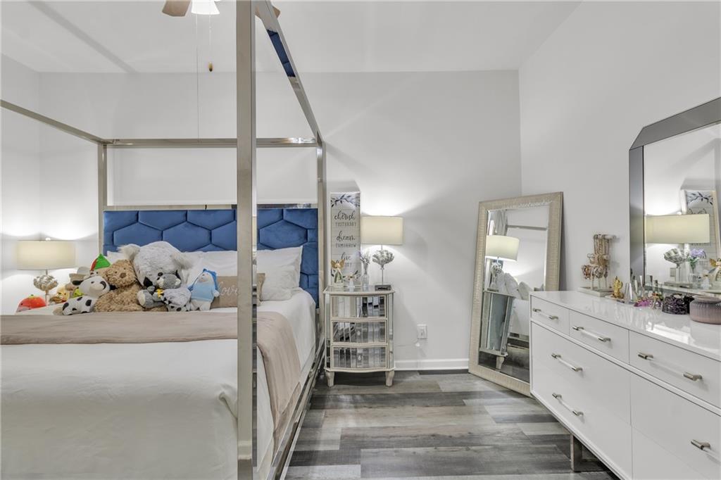 5483 Wylstream Way Norcross, GA 30093 - Photo 50 of 56 a bedroom with furniture and window