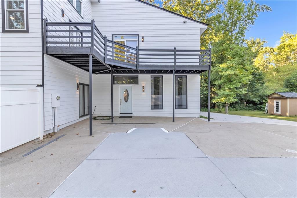 5483 Wylstream Way Norcross, GA 30093 - Photo 51 of 56 a view of a house with a backyard and trees