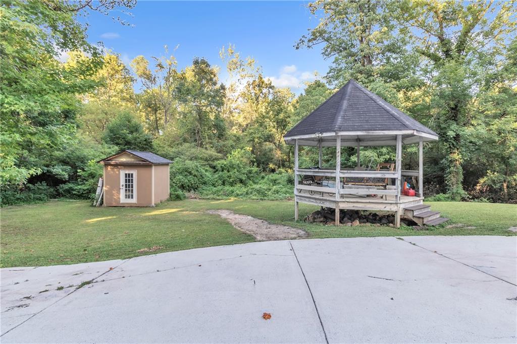 5483 Wylstream Way Norcross, GA 30093 - Photo 54 of 56 a house view with a garden space