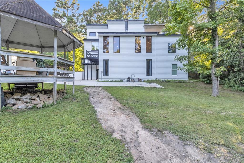 5483 Wylstream Way Norcross, GA 30093 - Photo 55 of 56 a view of a house with backyard and sitting area
