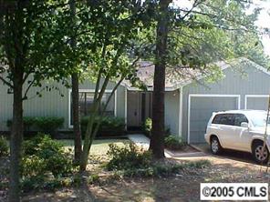 a view of a car parked in front of a house