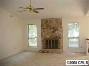 6832 Pence Road Charlotte, NC 28227 - Photo 2 of 8 a view of an empty room with a fireplace
