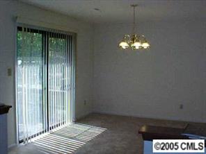 6832 Pence Road Charlotte, NC 28227 - Photo 3 of 8 a view of a livingroom with a chandelier fan