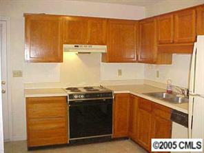 6832 Pence Road Charlotte, NC 28227 - Photo 5 of 8 a kitchen with a stove and a sink