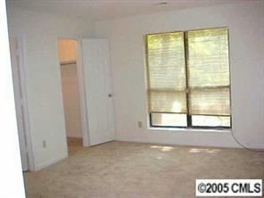 6832 Pence Road Charlotte, NC 28227 - Photo 6 of 8 a view of an empty room with a window