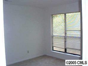 6832 Pence Road Charlotte, NC 28227 - Photo 8 of 8 a view of a room that has a window in it