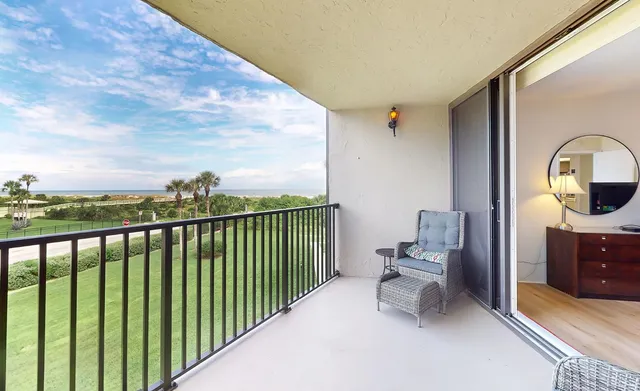 a view of a balcony with furniture