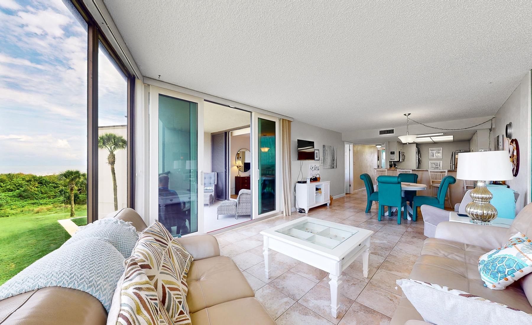 1 Dondanville Road, Unit C 215 St. Augustine, FL 32080 - Photo 2 of 33 a living room with furniture and a large window